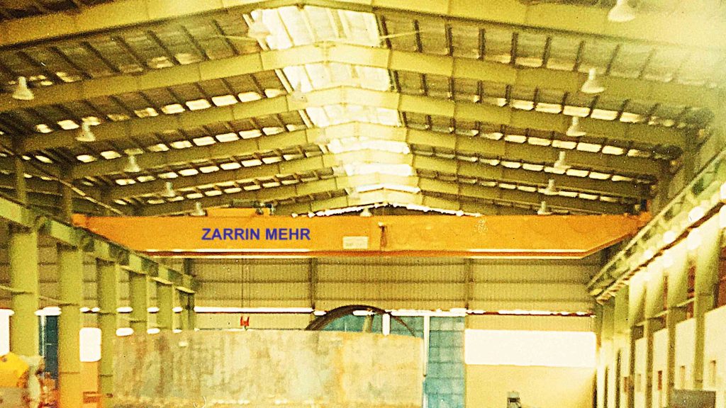 Zarrin Mehr Double Girder Overhead Crane demonstrating heavy-duty lifting and material handling capabilities in an industrial setting, similar to gantry crane and electric hoist solutions.