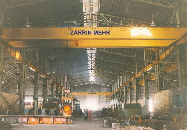 Overhead Crane Performing Heavy-Duty Lifting Tasks in Industrial Facility