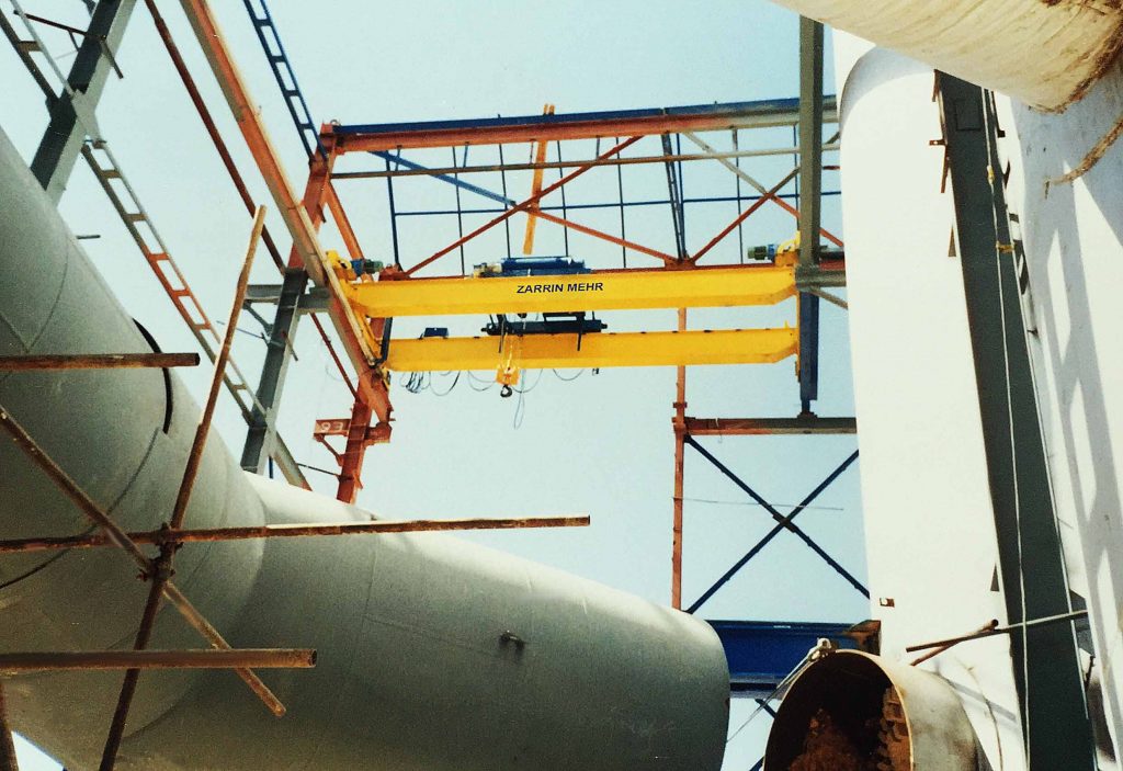 Overhead Crane Performing Heavy-Duty Lifting Tasks in Industrial Facility