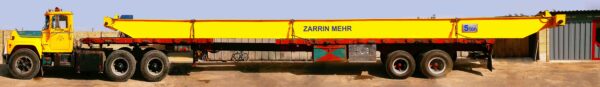 Trailer transporting a Zarrin Mehr Overhead Crane, a reliable alternative to gantry crane rentals and electric winch systems.