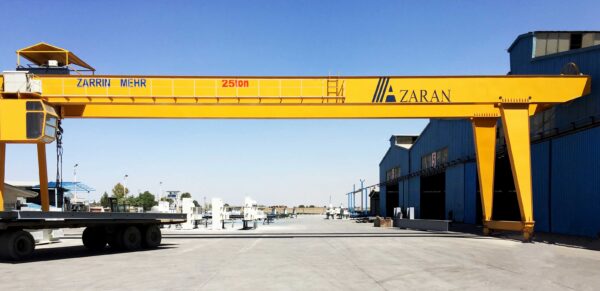 25-ton Double Girder Gantry Crane equipped with electric hoists, performing heavy-duty lifting in an industrial setting.
